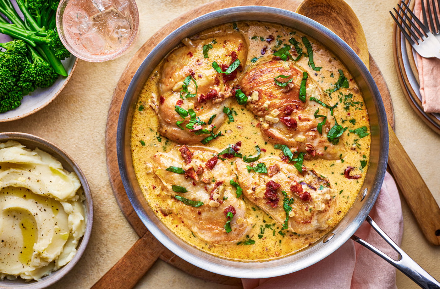 Chicken dinner in a pan with herbs